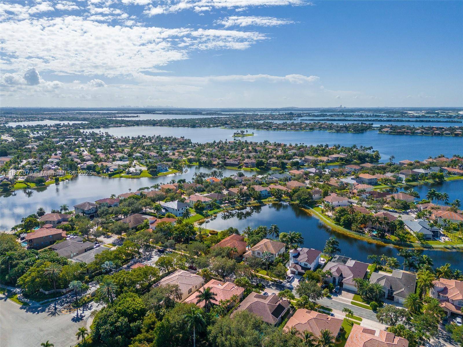 Experience lakeside living at its best in this beautifully maintained 5 bedroom, 3 bath home in the sought after community of Sunset Lakes.