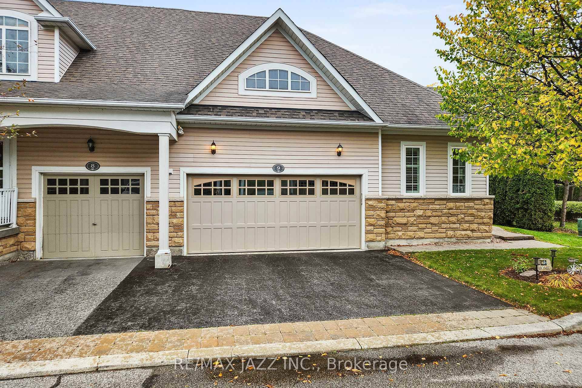Welcome to 350 Lakebreeze Drive, Unit 9 a place where lakeside tranquility meets refined luxury.