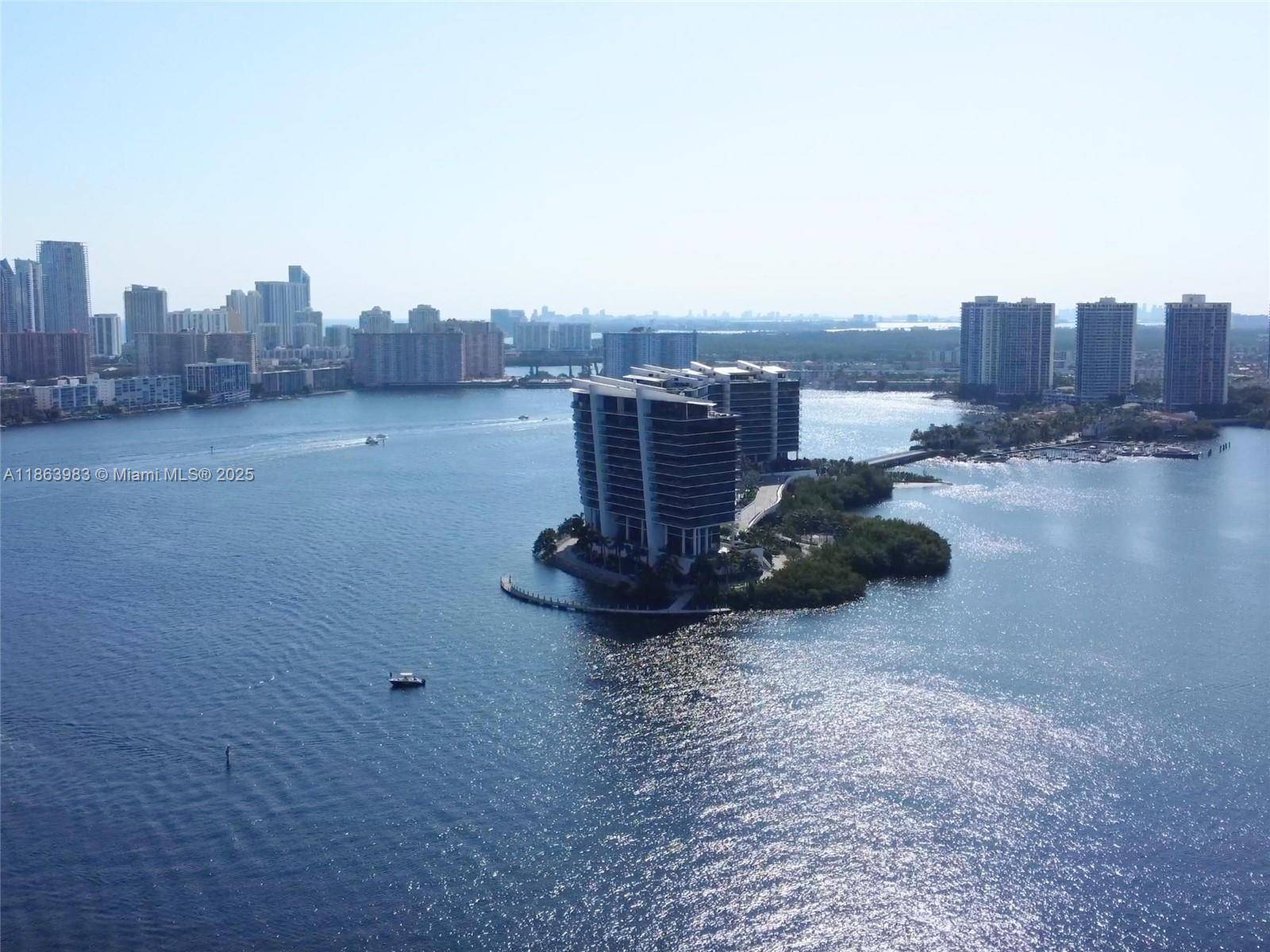 High above the marina, where the breeze carries the hush of the bay, this 2 bed, 2 bath sky retreat invites you to live surrounded by light and stillness.