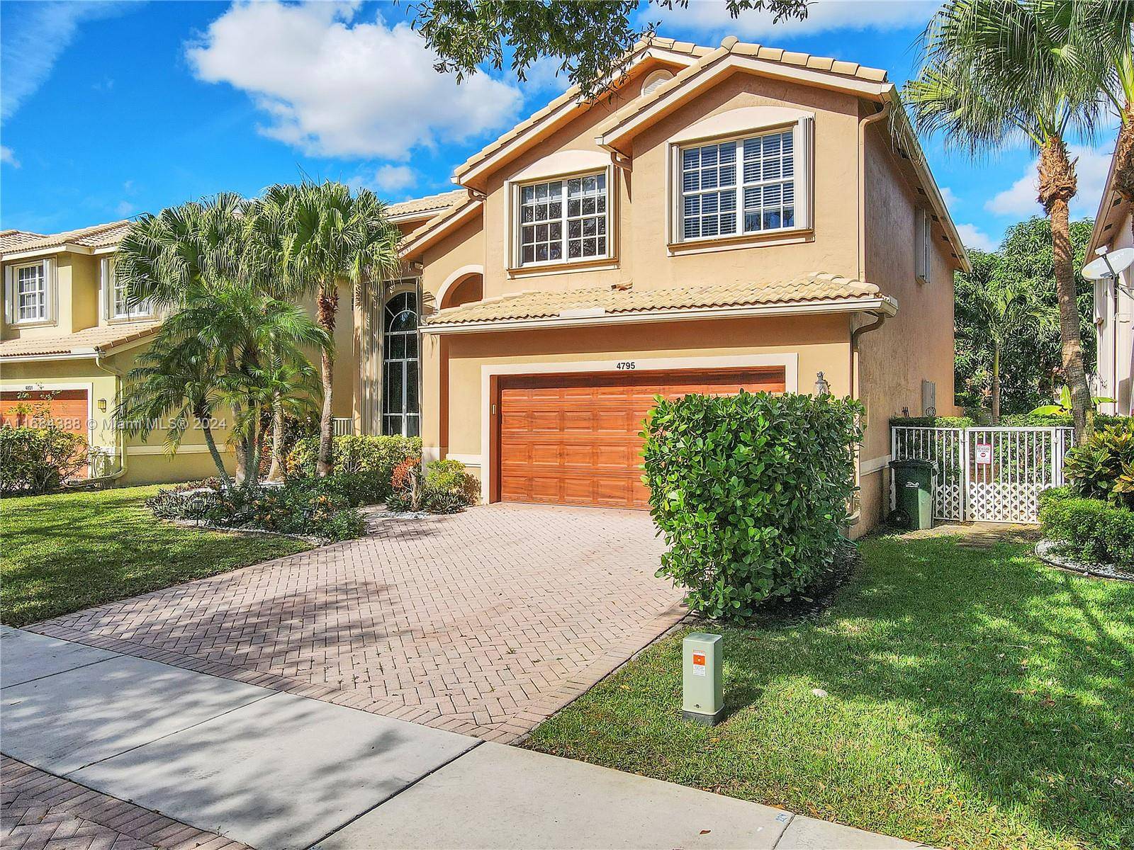 Situated in the prestigious community of The Colony at Delray, this magnificent 4 bedroom, 2.
