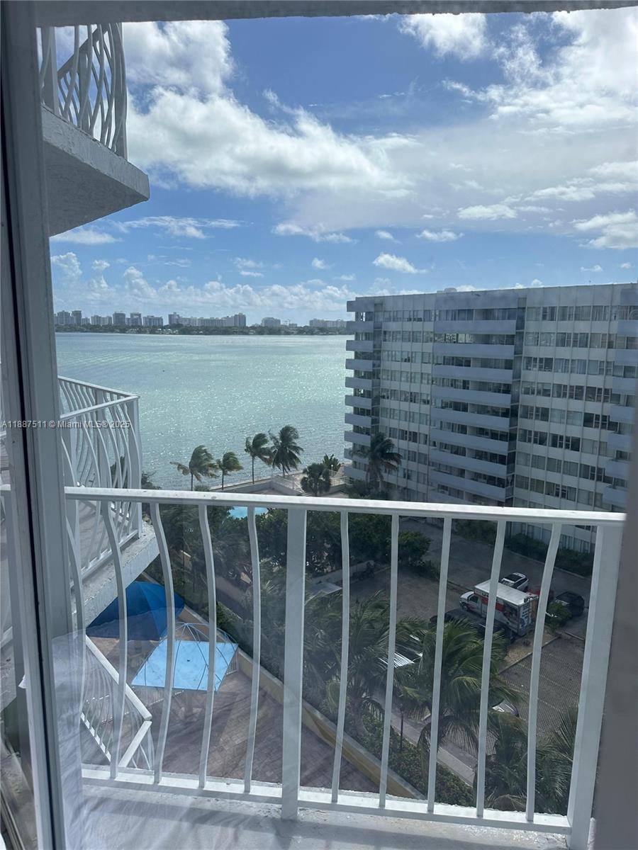 Enjoy stunning water views from this beautifully situated 2 bedroom, 2 bath corner unit in the heart of North Bay Village.