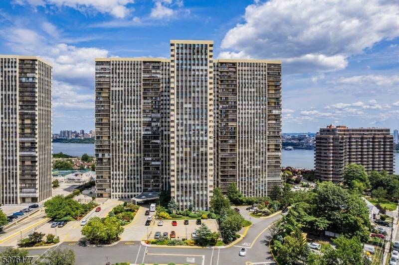 With A Breathtaking View of the NYC SKYLINE, GEORGE WASHINGTON BRIDGE, HUDSON RIVER, Scenic Boating Traffic, 4th of July Fireworks Display And MORNING SUNRISES, This Exclusive 28th Floor Corner Unit ...