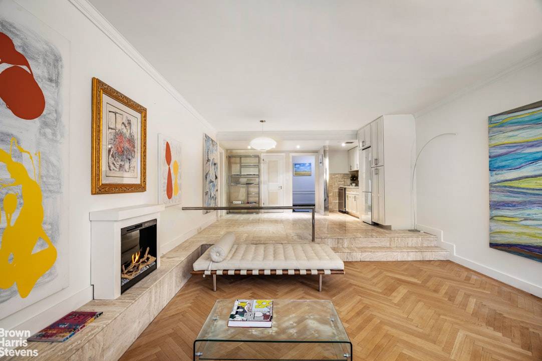 Enjoy loft like living in this unique Central Park South one bedroom residence with new kitchen, elegant entry foyer and a home office.