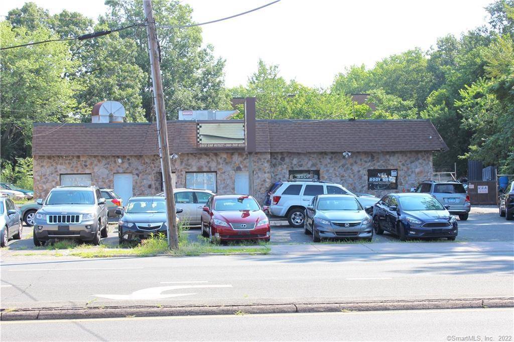Great Opportunity for Investors or Owner Occupants with Car Business Included in a High Traffic Area !