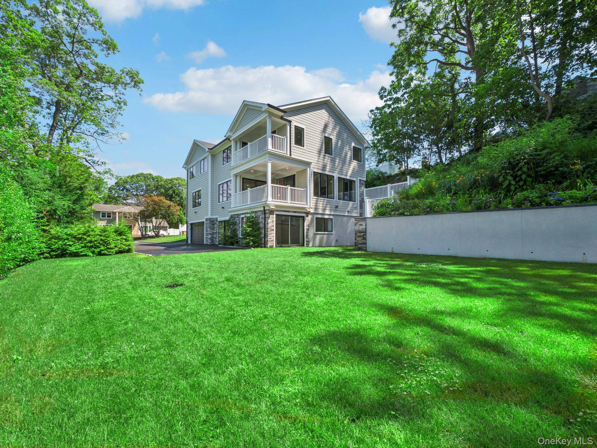 Exceptional new construction colonial nestled in the prestigious hamlet of Woodbury, NY.
