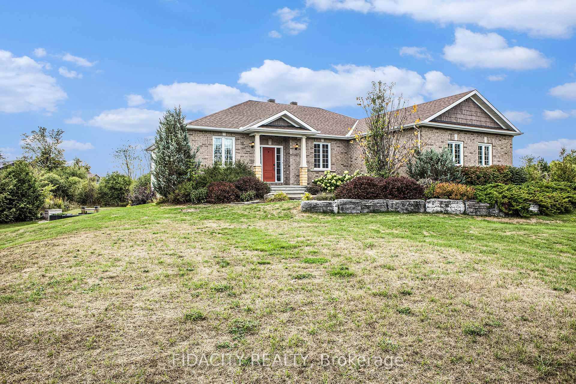 Welcome to 16 Canadian, a warm and inviting bungalow on 2 acres tucked along the fairways of a beautiful golf course.
