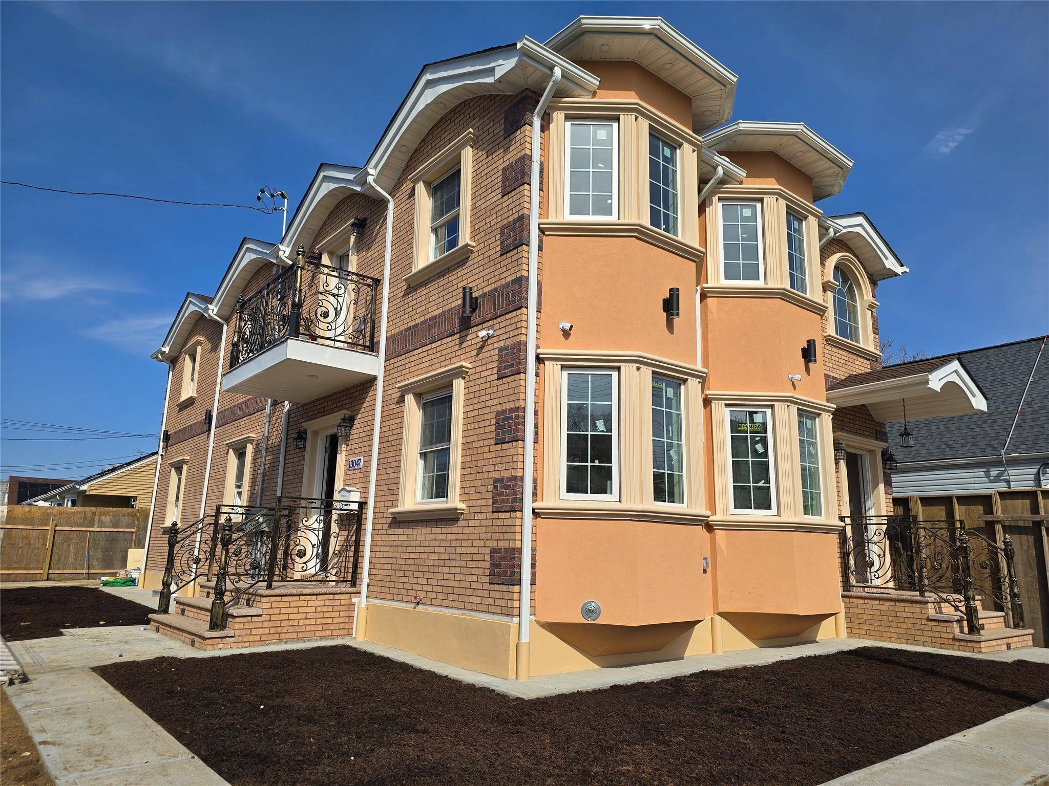This impressive corner property, constructed with brick and stucco, features a generous lot size of 45x95 feet.