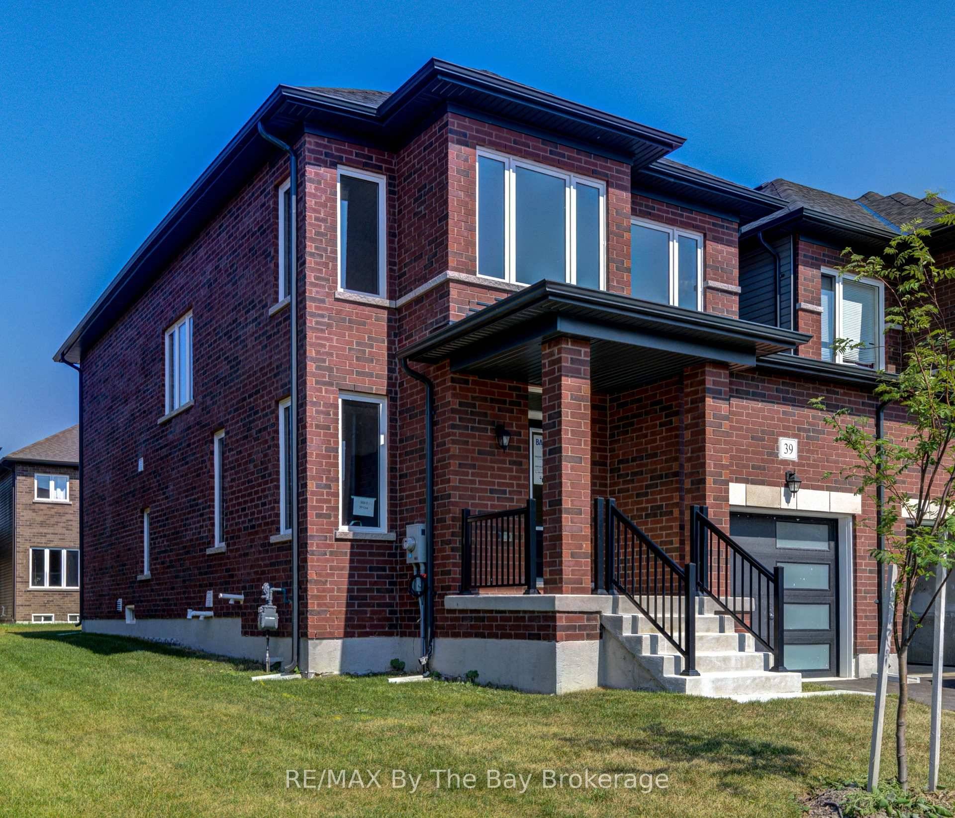 Move in ready end unit Freehold Townhome by Baycliffe Communities in the Villas of Upper Wasaga.