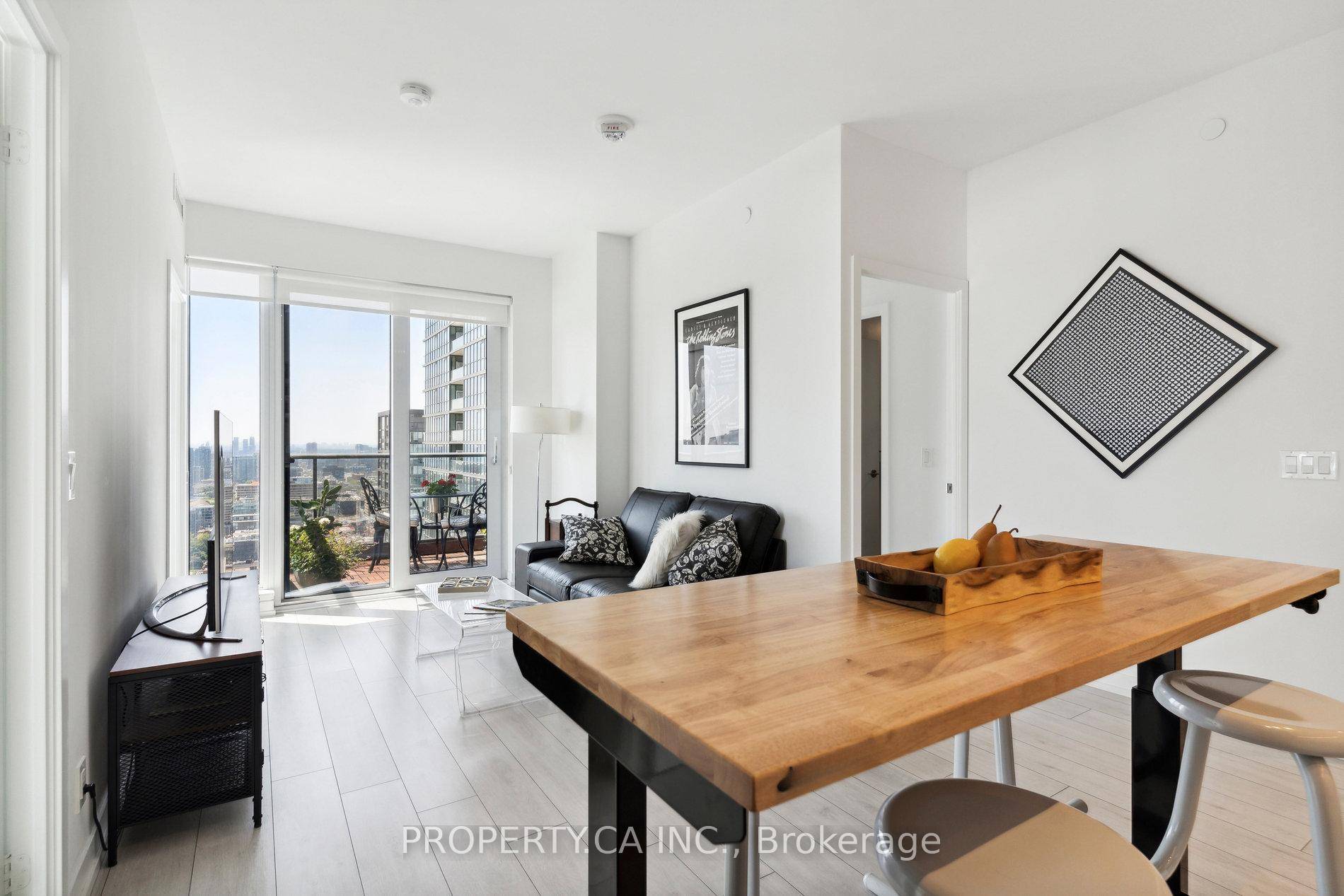 Soaring high above the city on the 41st floor, Suite 4102 showcases stunning southwest views of Torontos iconic skyline, the CN Tower, and shimmering Lake Ontario.