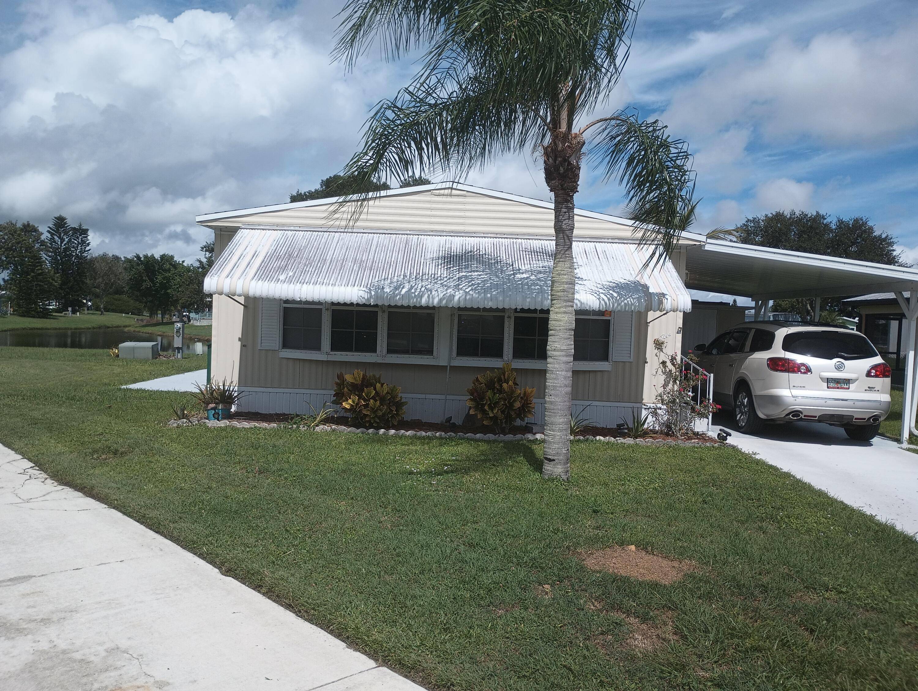 BEAUTIFUL LAKESIDE HOME in great condition located in the much desired 55 community of Spanish Lakes Riverfront.