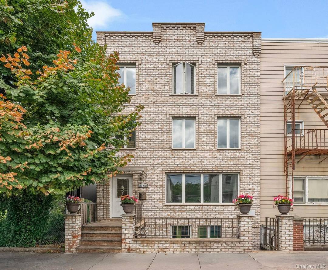 This brick semi detached three family home offers outstanding income potential in Astoria.