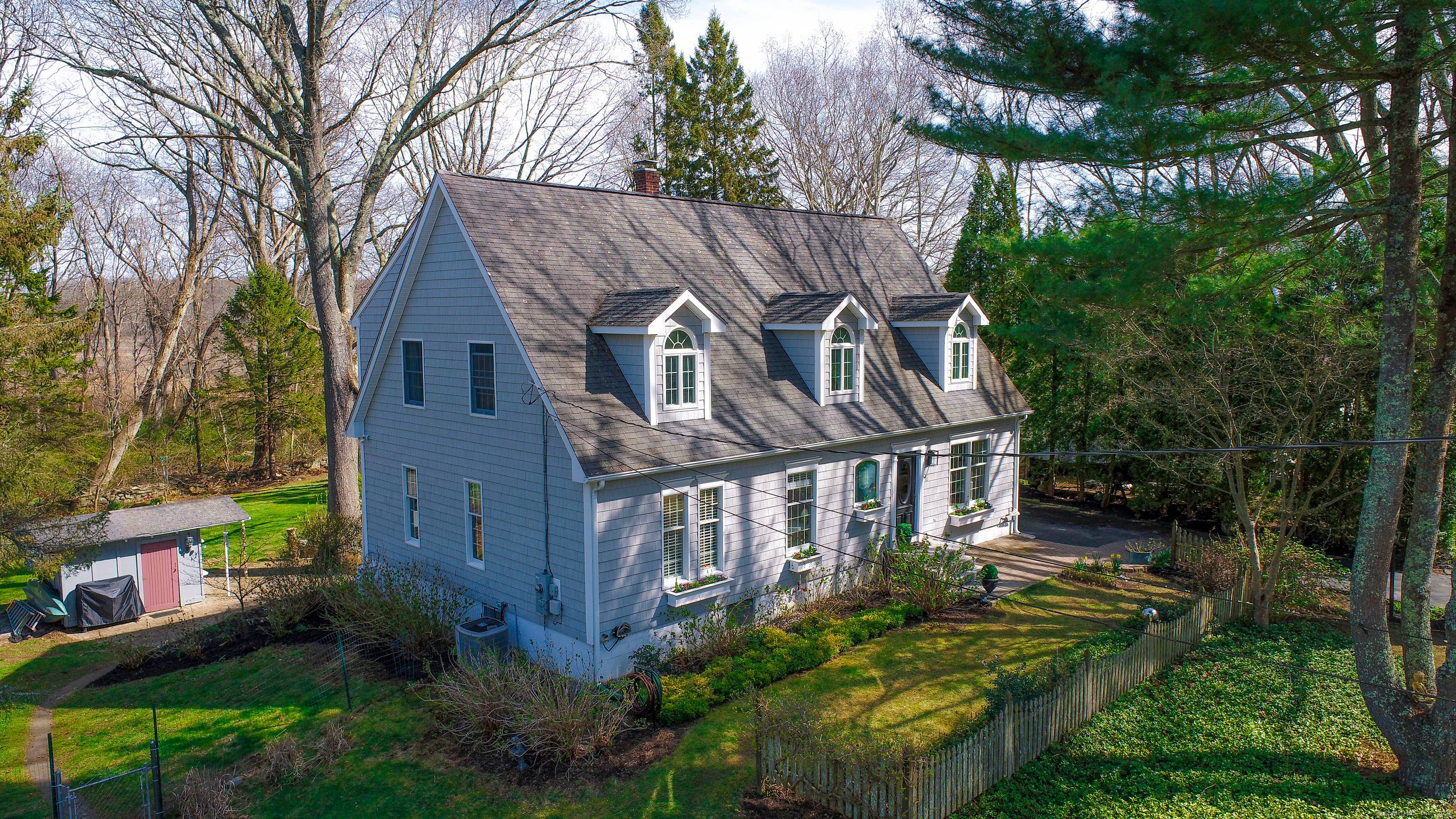 Whether you're seeking a peaceful oasis or an elegant home for entertaining, this Mystic Cape offers it all.