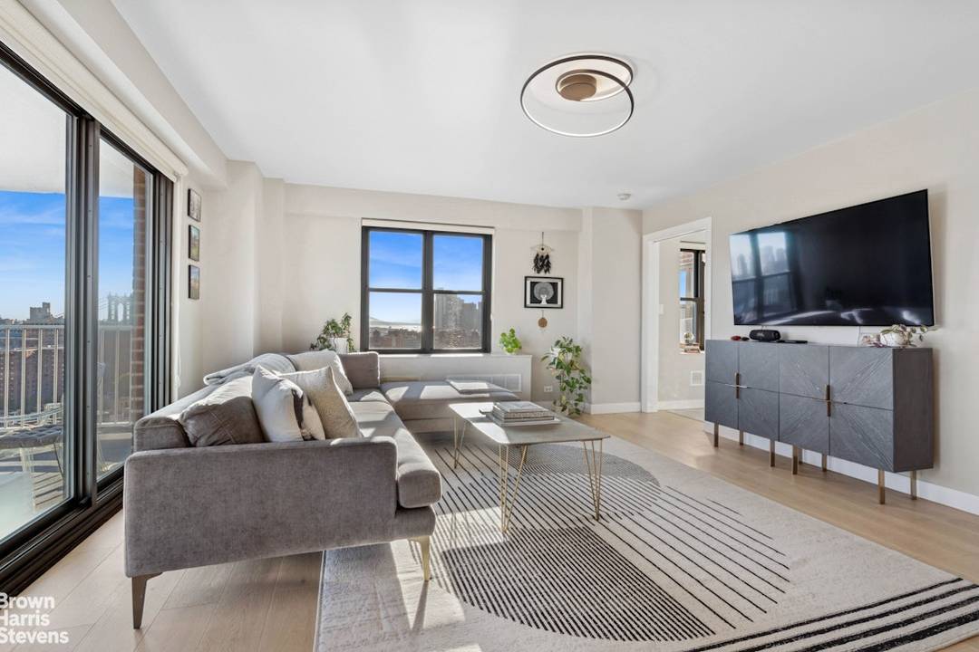 One of a Kind ! This fully renovated top floor home features an expansive great room opening to a 125 square foot private terrace with dramatic views to the downtown ...