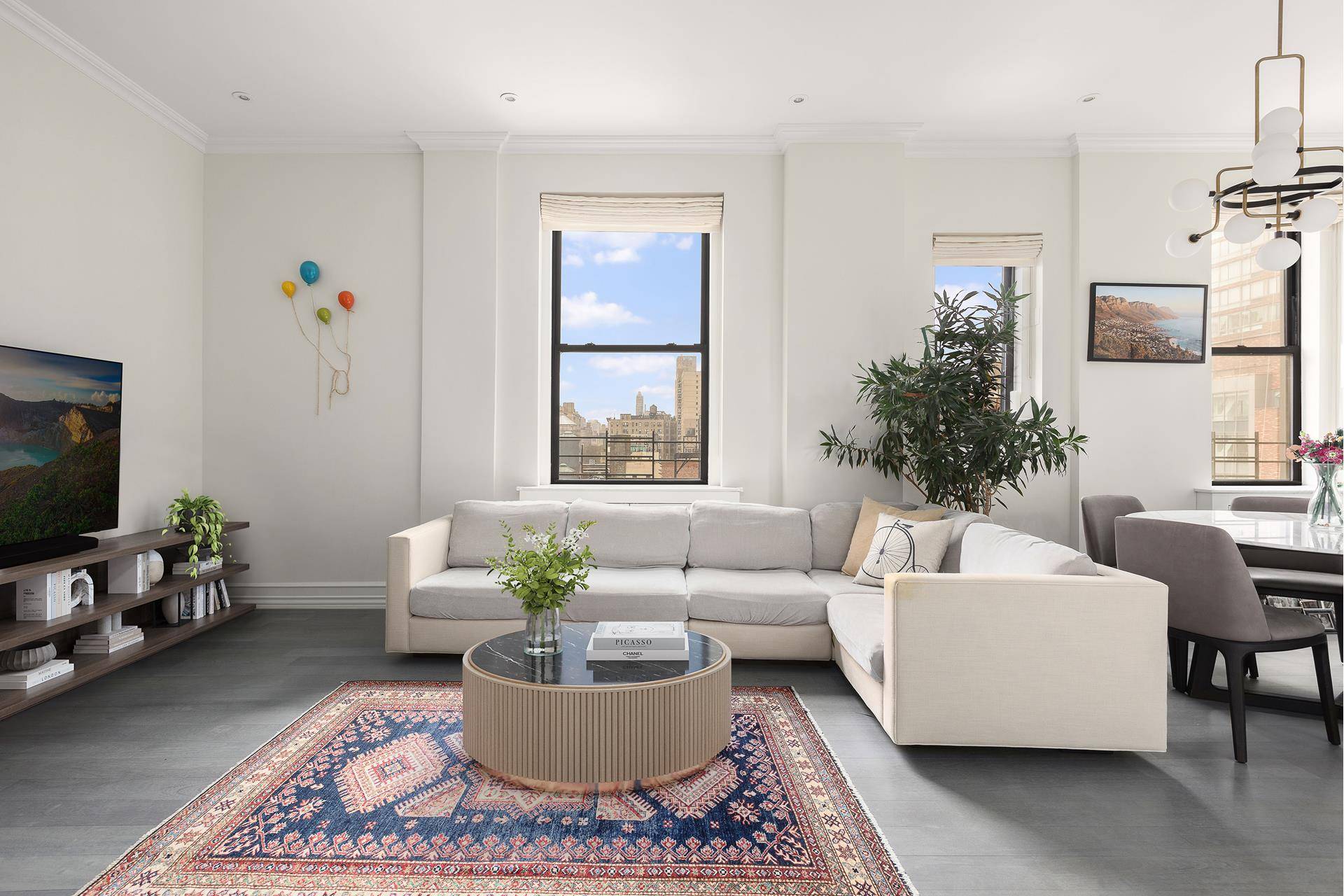 Upon entry, you're welcomed into a gracious living and dining area lit by a wall of oversized windows showcasing historic Upper West Side architecture and a striking glimpse of Central ...