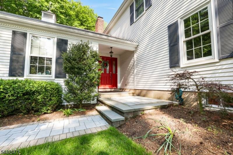 Welcome home to this beautifully maintained Colonial nestled on a manicured wooded lot in the highly sought after Pines Lake section of Wayne.
