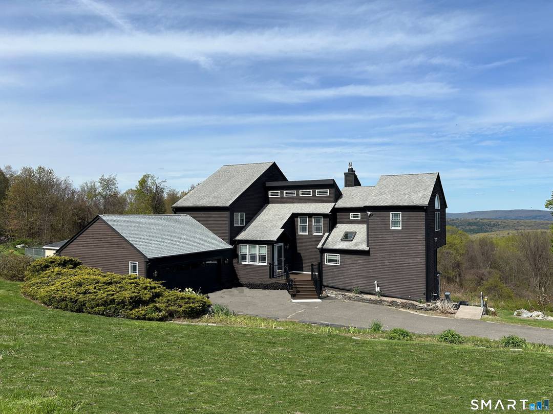 Perched atop Taine Mountain w dramatic, panoramic mountain views, this extensively renovated estate is a rare blend of luxury, comfort, timeless design perfect for elegant entertaining everyday living.