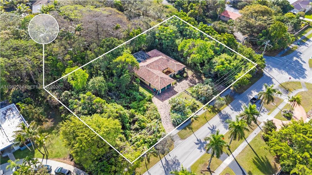 JUST UNDER AN ACRE, this 38, 200 sq ft corner lot offers a rare opportunity, surrounded by mature trees and lush tropical landscaping.
