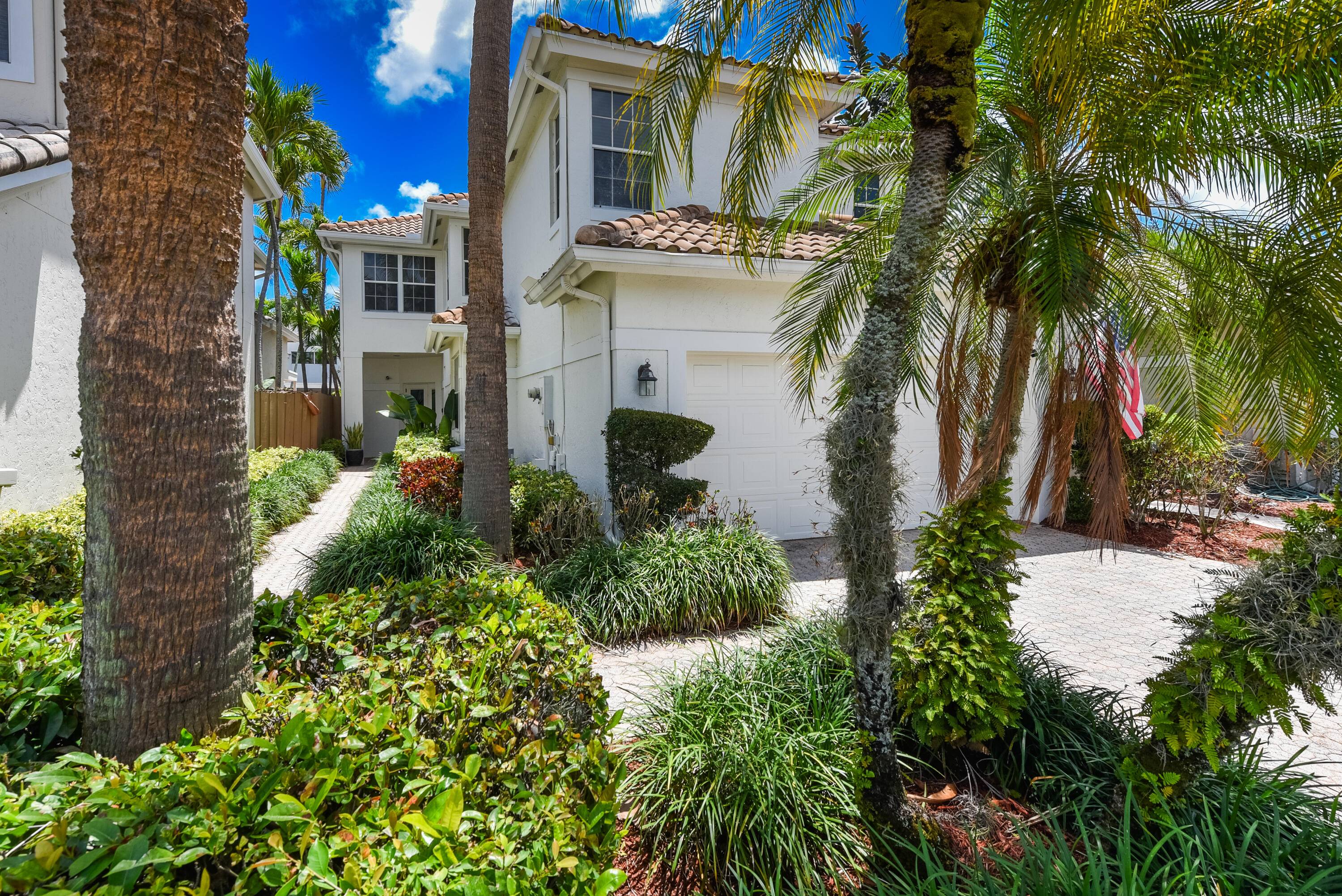 Enjoy living in the Village of the Banyans within Broken Sound Country Club.