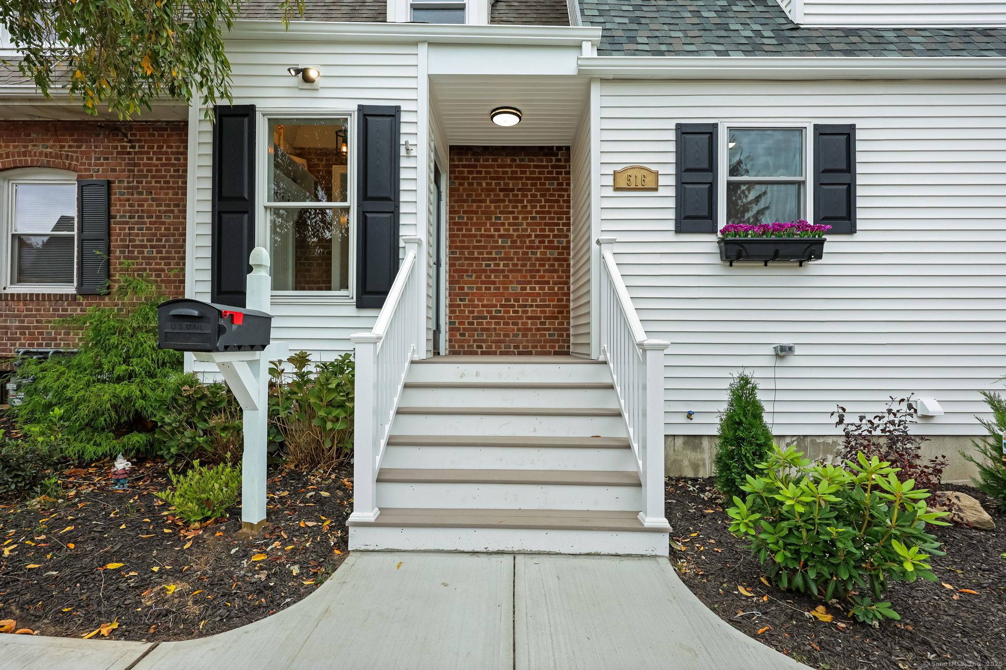 Lordship newly expanded 1 2 duplex townhouse featuring covered front porch, entry hall, Living room with HW floors, Dining room with HW floor and recessed lights, Newer Kitchen with white ...