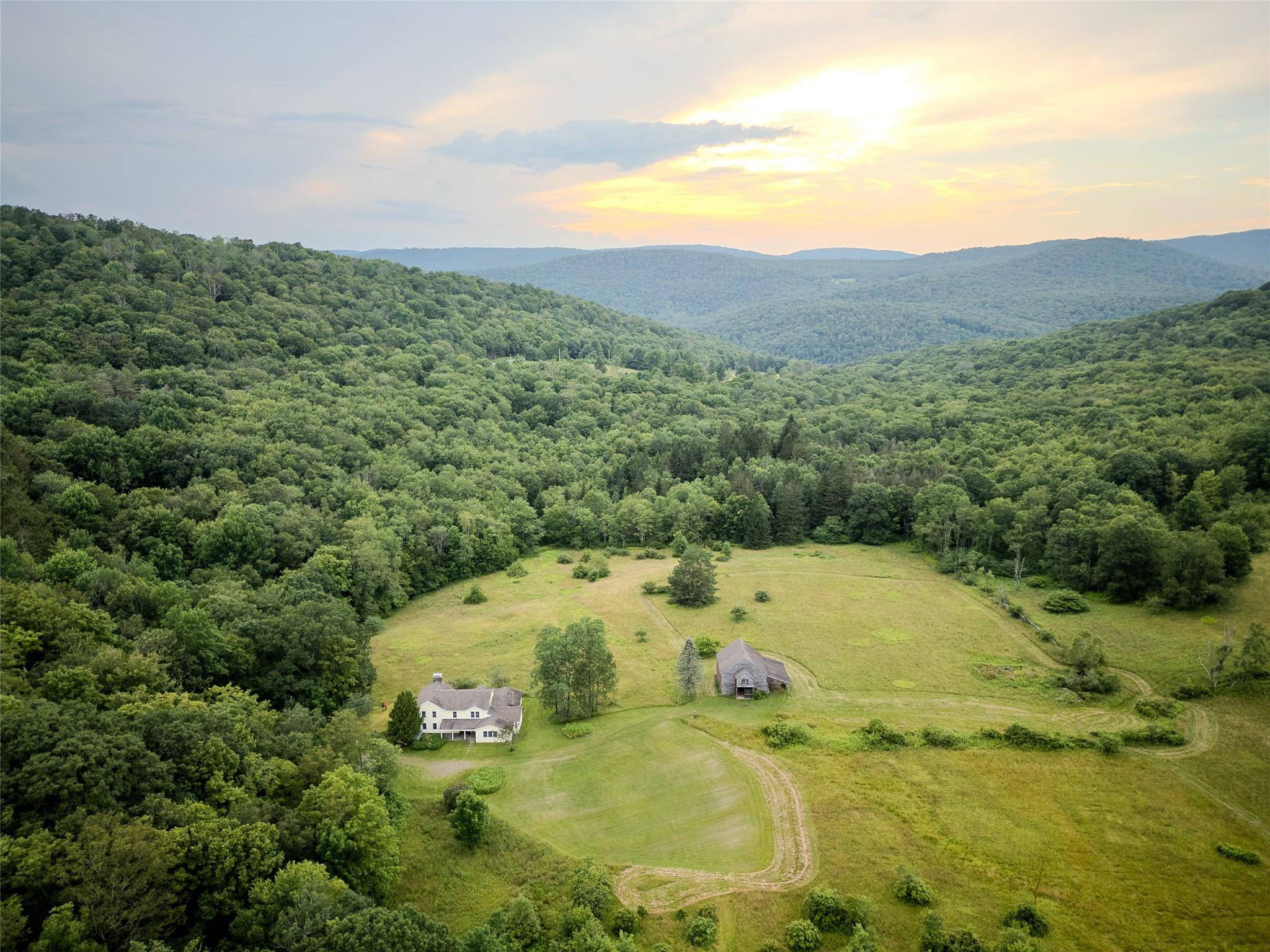 Step back in time and embrace the peaceful rhythms of country living with this extraordinary 1900s farmhouse, gracefully situated on a sprawling 250 acre estate.