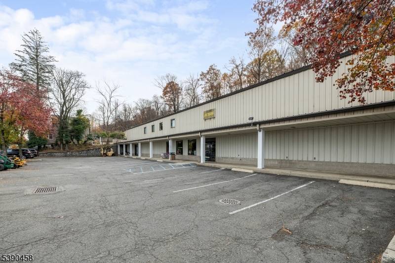 Sitting on over an acre of land, this expansive commercial property located in the heart of Cedar Grove offers exceptional visibility and versatility.