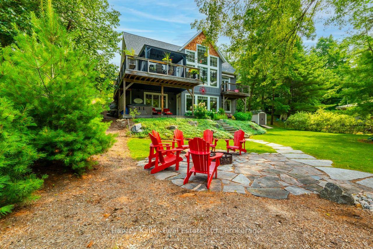 Custom built one owner South West facing Year Round Lake Muskoka beauty ideally located between Beaumaris and Port Carling on 101 Ft.