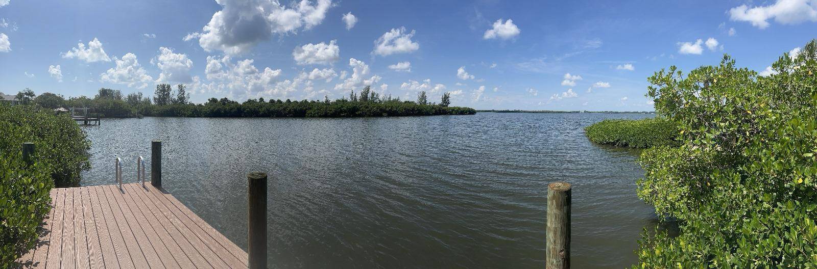 Beautiful waterfront vacant lot with large oak trees and west facing dock !
