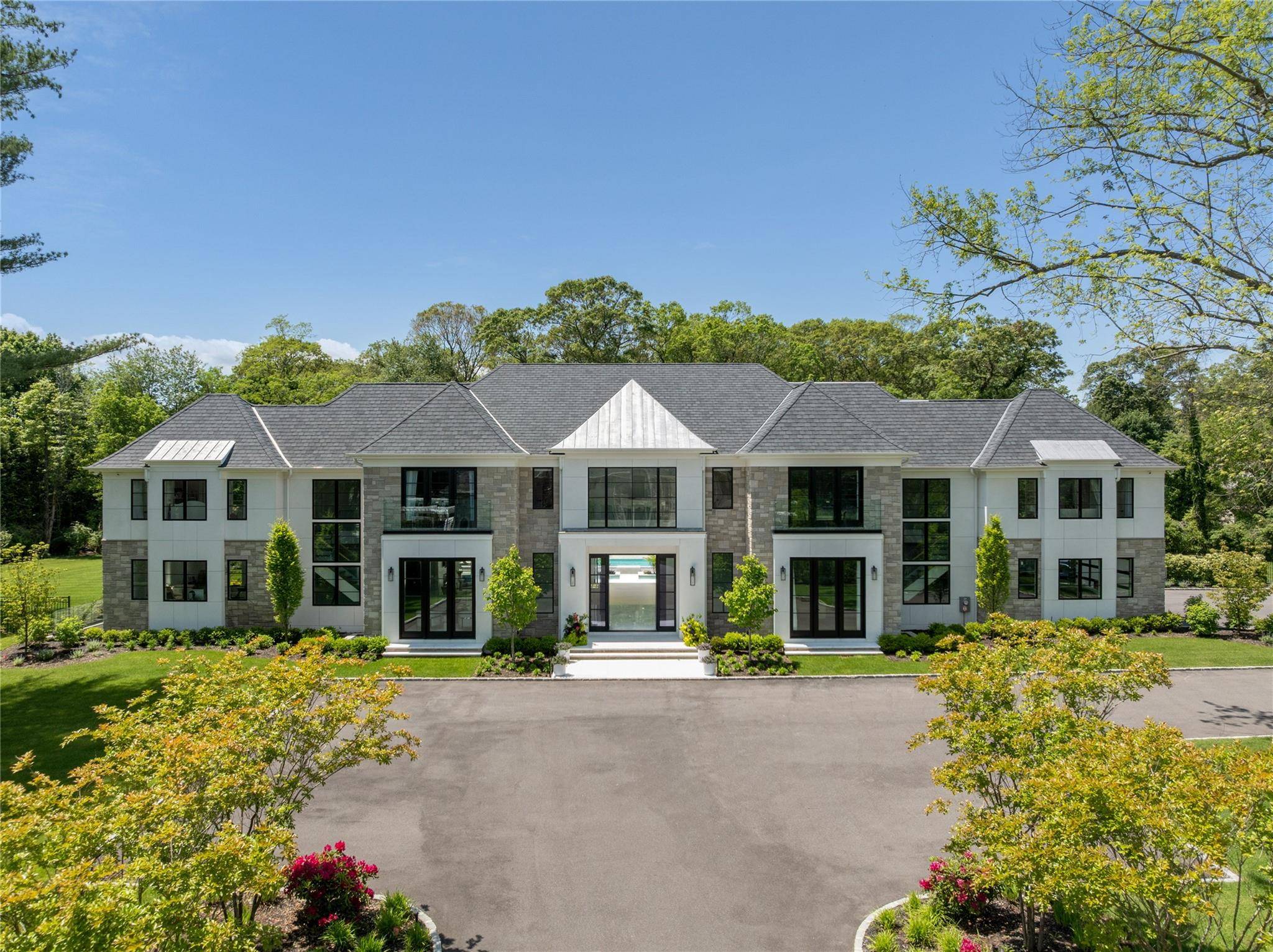 Set on 2 private and beautifully landscaped acres at the end of a cul de sac in the coveted Broad Hollow development of Brookville, this newly built estate offers over ...