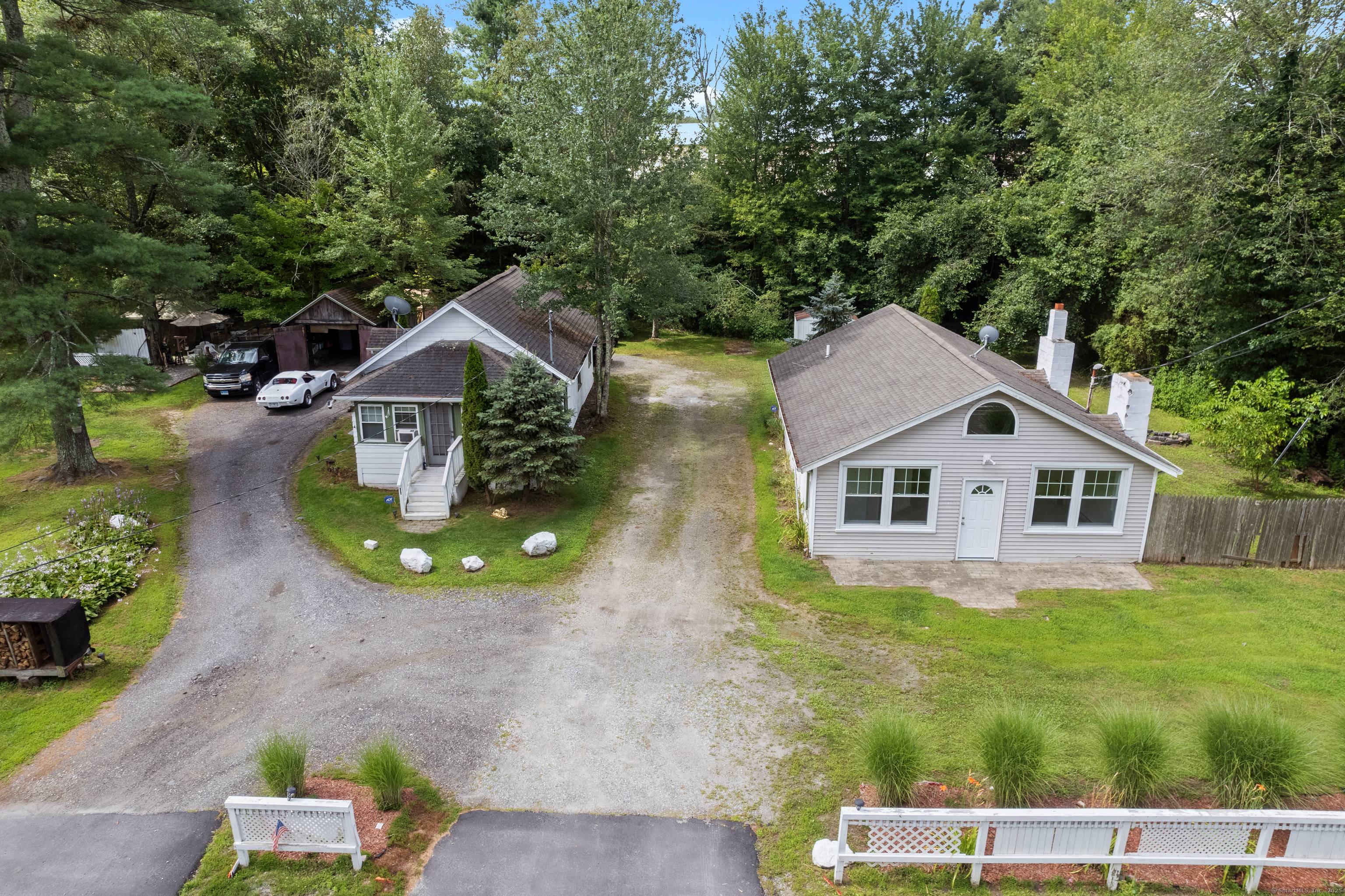 This acre and a half parcel consists of two small ranch style dwellings, multiple sheds, and a 2012 constructed barn.