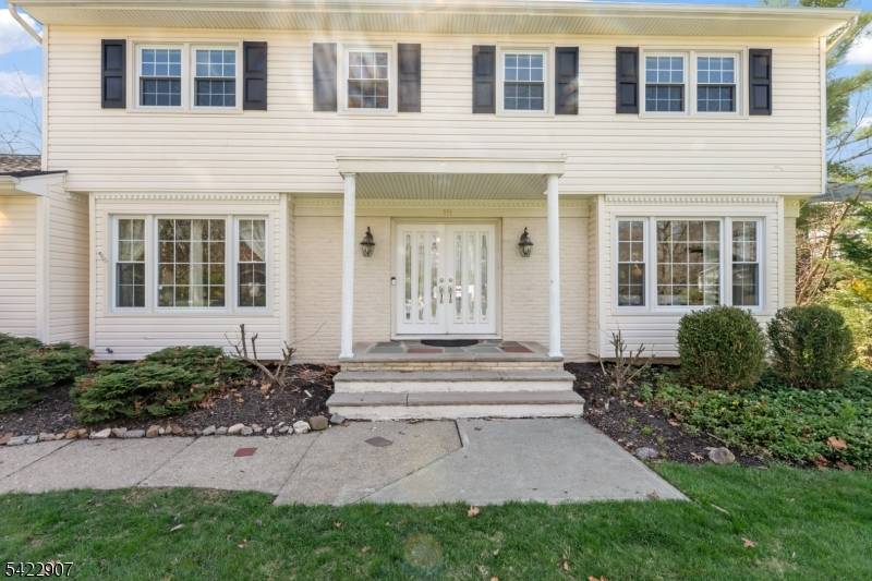 Nestled within the highly sought after community, this exceptional home is set in a picturesque neighborhood surrounded by mature landscaping, offering a peaceful and scenic setting.