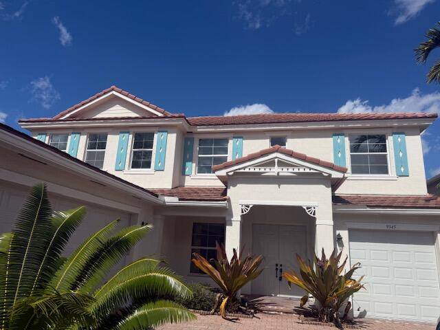 Gorgeous 5 bedroom plus loft home in prestigious gated community of Palm Beach Plantation.