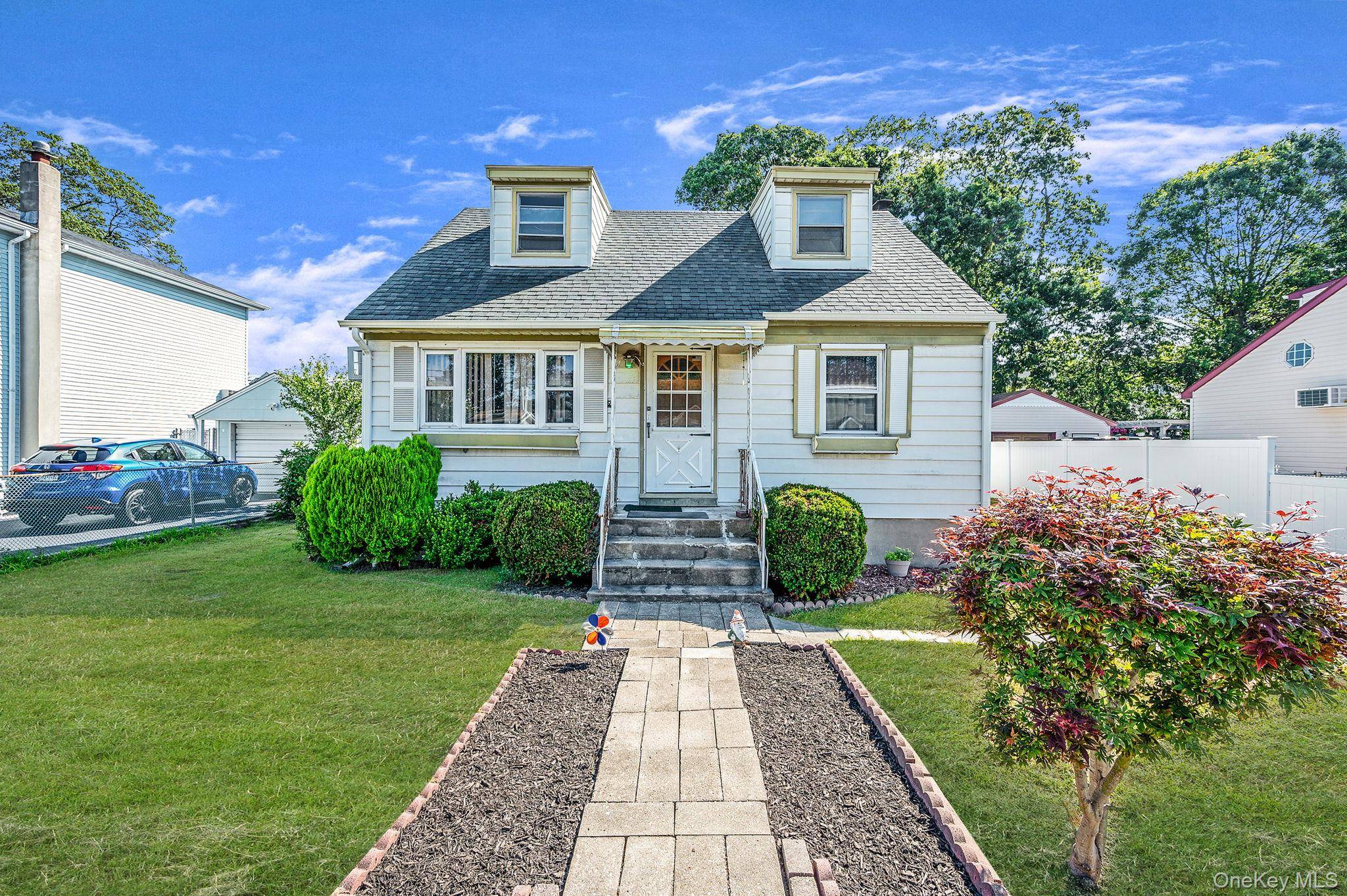 Charming 4 bedroom Cape with detached garage and full basement.