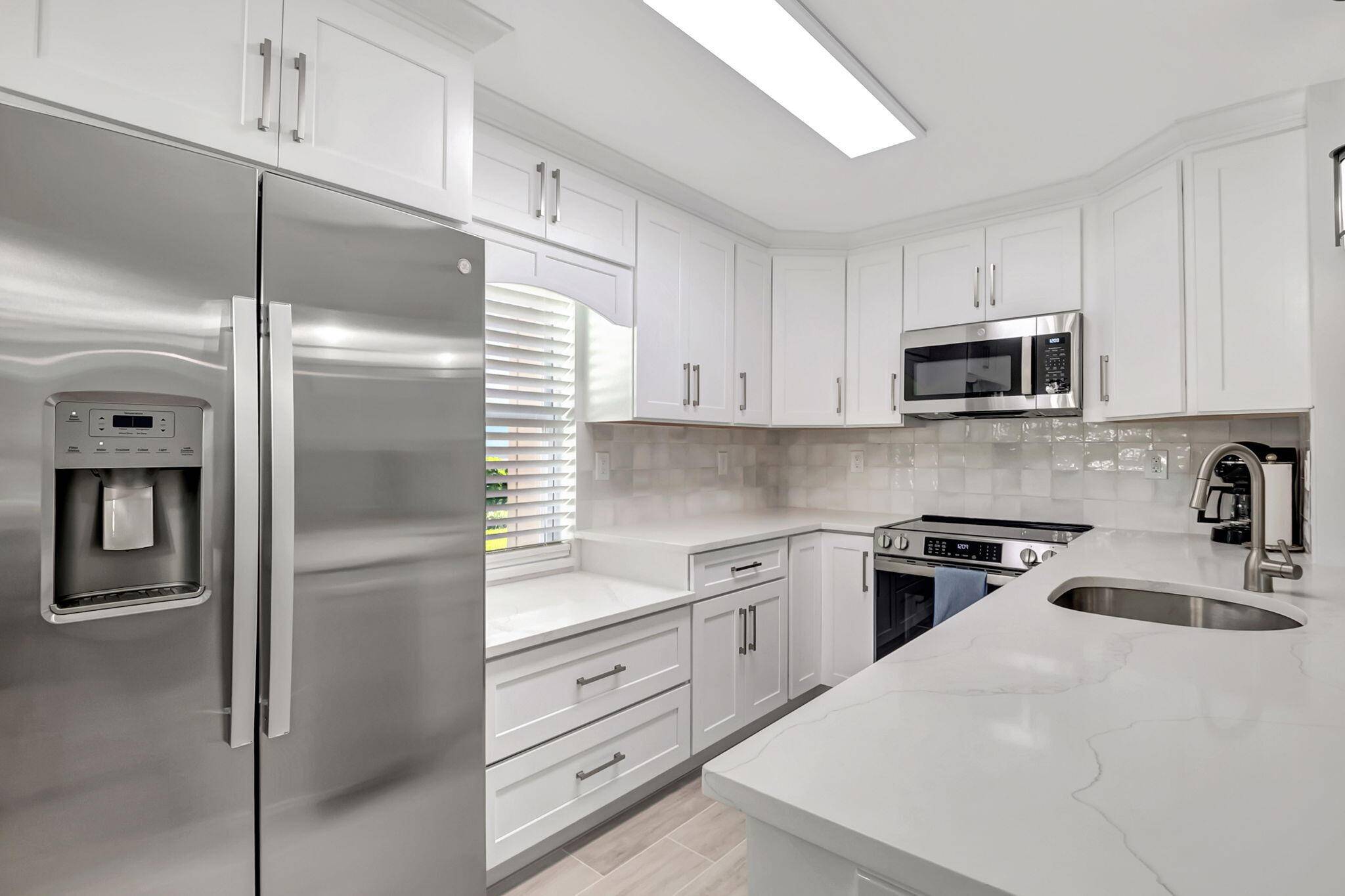 Step into luxury with this completely renovated 2 bed, 2 bath condo at 493 Flanders K, nestled in the vibrant 55 community of Kings Point Golf and Country Club.
