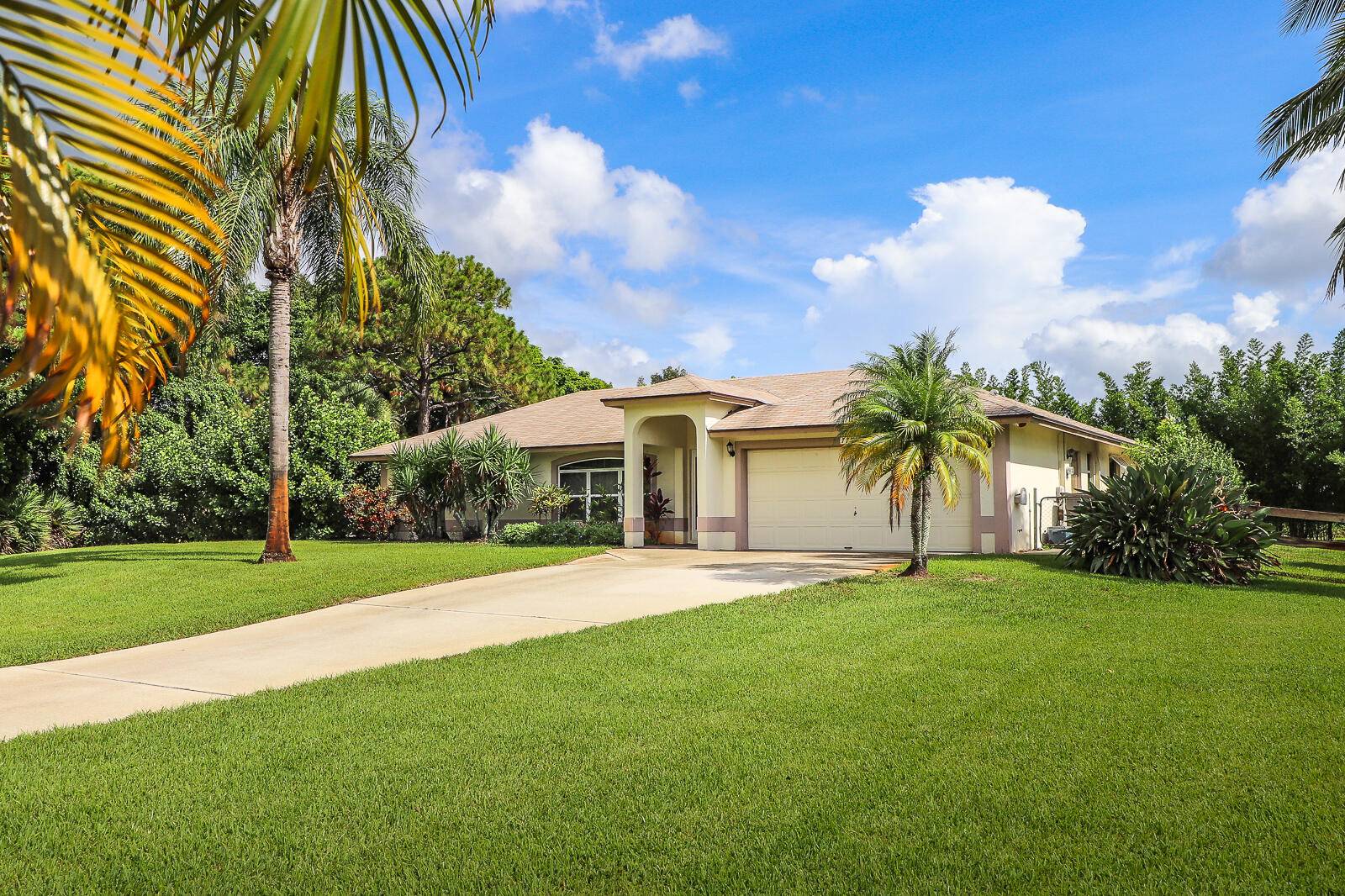 This immaculate 3 bedroom, 2 bath, 2 car garage CBS home with a pool is located on a private 1.