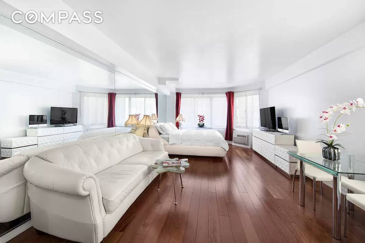 Perched on the top floor in a prime midtown Condo building, Apartment 12G offers a rare penthouse like experience with no upstairs neighbors.