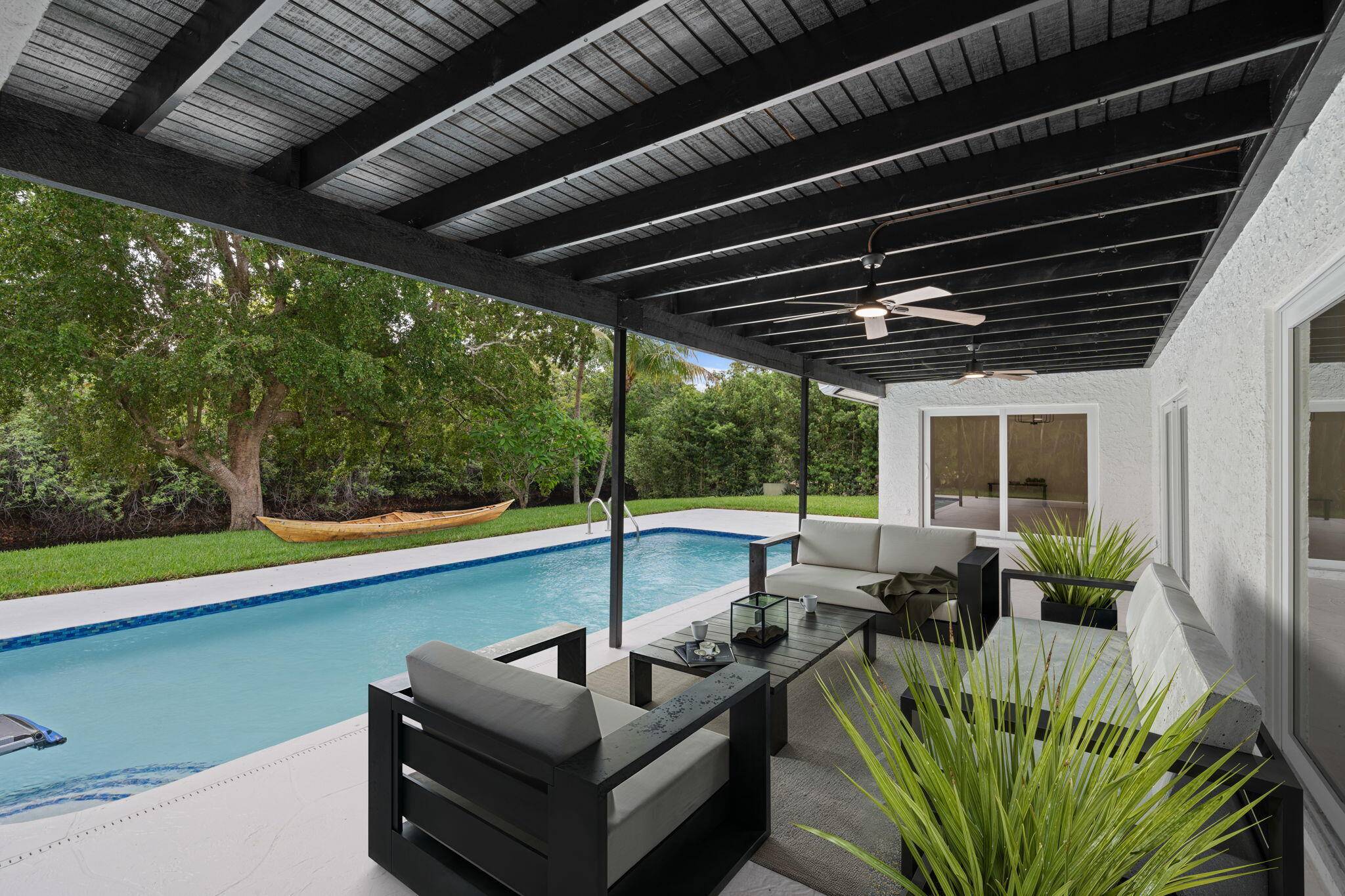 Step into elevated living with this stunning designer home in the sought after Loggers Run community of West Boca Raton.