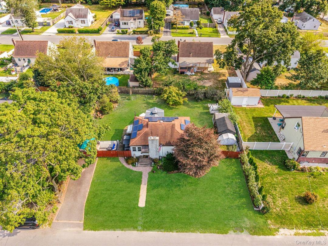 This immaculately maintained two bedroom ranch in the heart of Central Islip is brimming with personality and perfectly situated on an oversized lot.