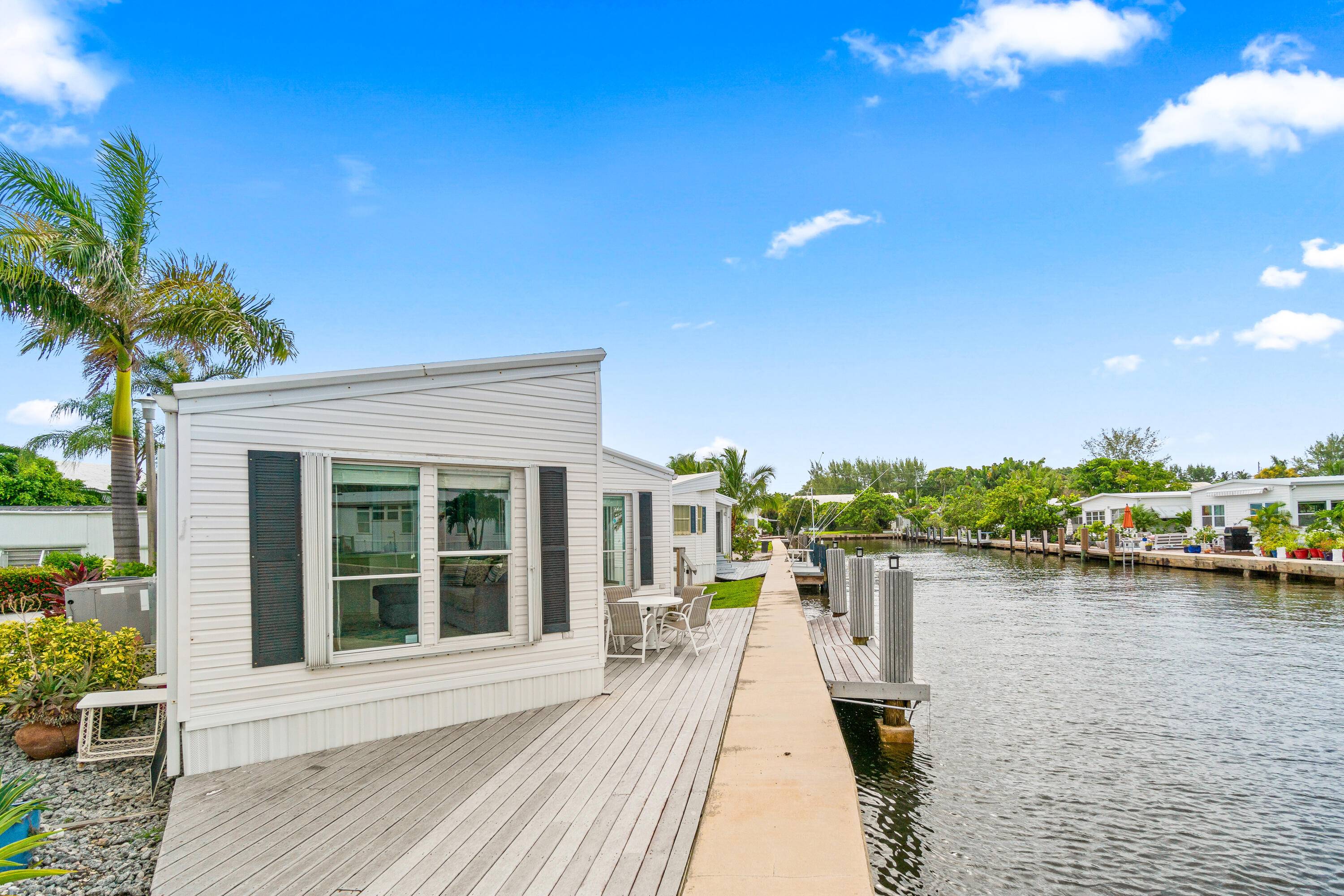 Offered for sale with 46 shares in the Briny Breezes Cooperative, this spacious 2 bedroom, 2 bath home offers panoramic water views from nearly every angle.