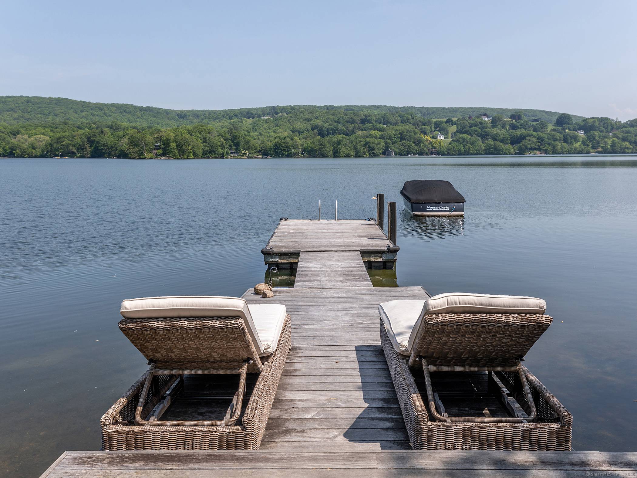 Escape to this incredibly charming Lake Waramaug cottage offering exceptional views from every window.