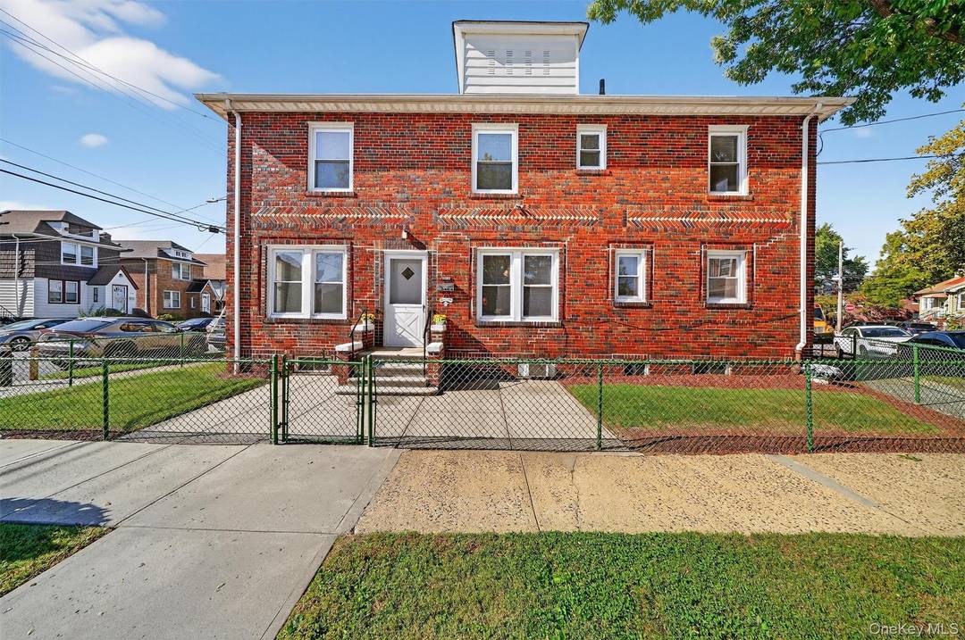HUGE BRICK DETACHED single family in Pelham Bay four beds 2 baths with office room plus finished basement, large front patio with upstairs porch.