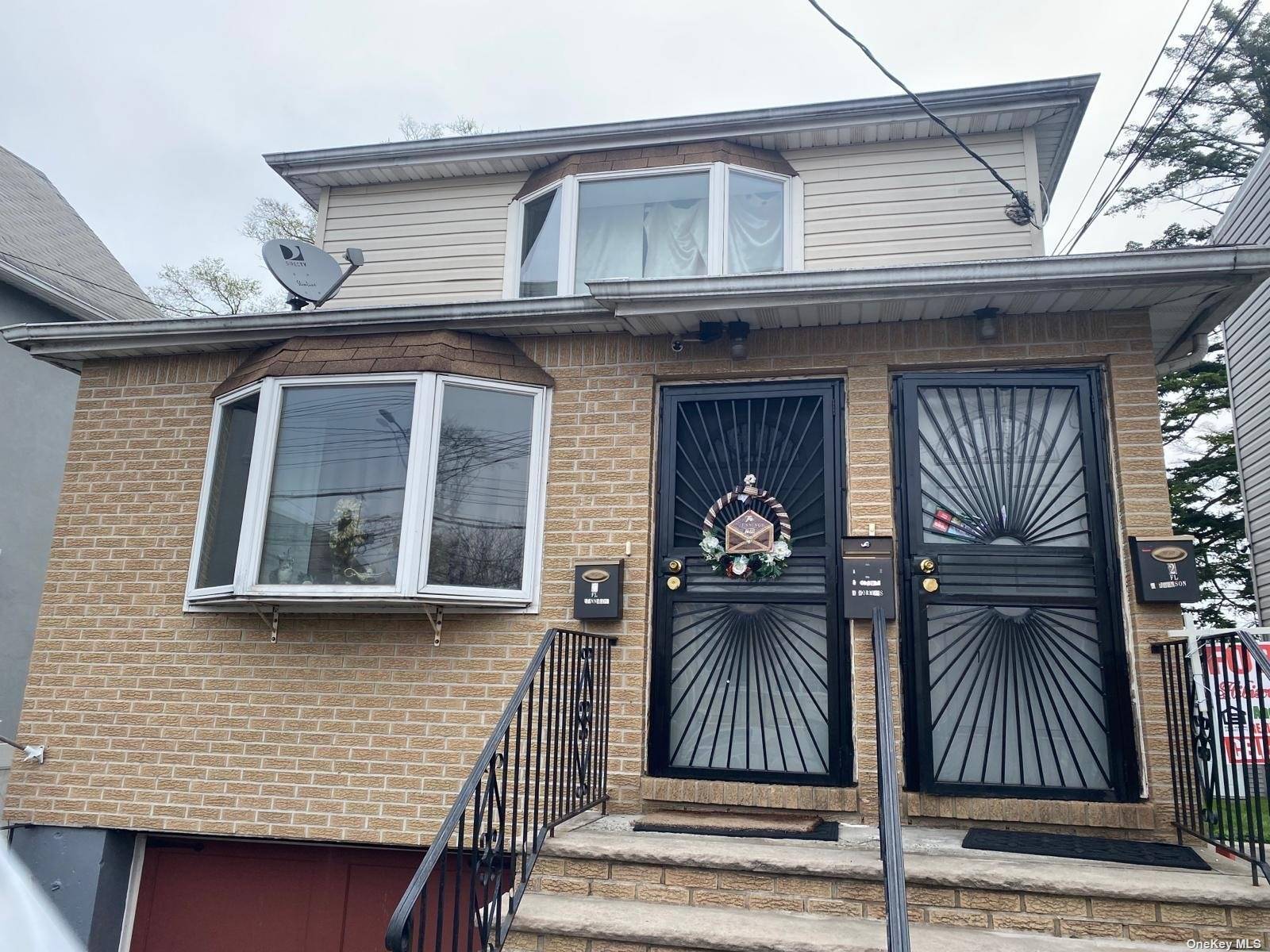 Detached 2 family Hi Ranch with private driveway and deck in backyard.