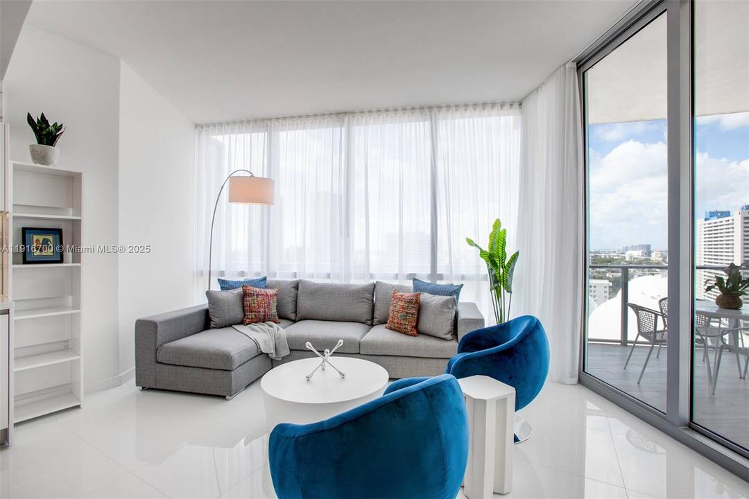 Truly the most exquisitely furnished 1 Bed Den, 2 Bath residence at Miami Worldcenter, featuring a private elevator entrance, soaring 10 foot ceilings, and designer interiors by NMR Design Miami.