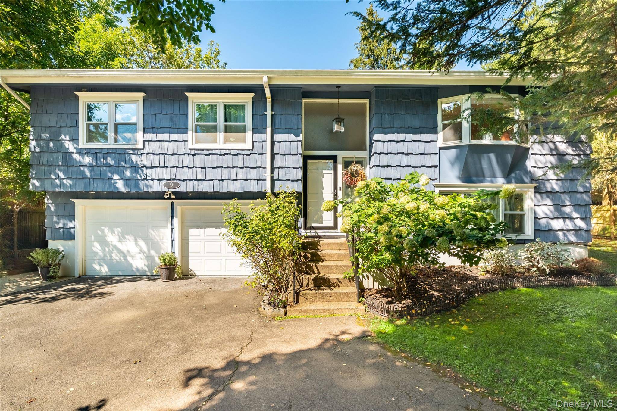 Welcome to 9 Brookdale Drive in Hartsdale, a beautifully renovated raised ranch offering style and comfort.