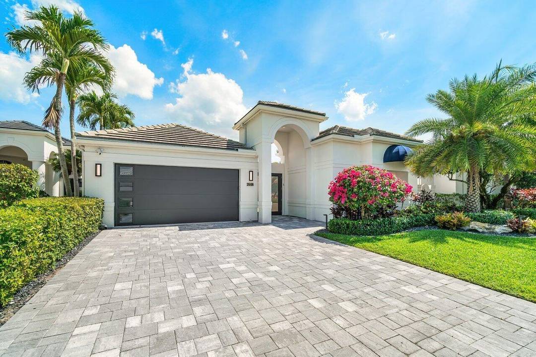 Stunning modern 4 BD 4. 5 BA furnished courtyard home in Clubside of Woodfield Country Club with full golf privileges.