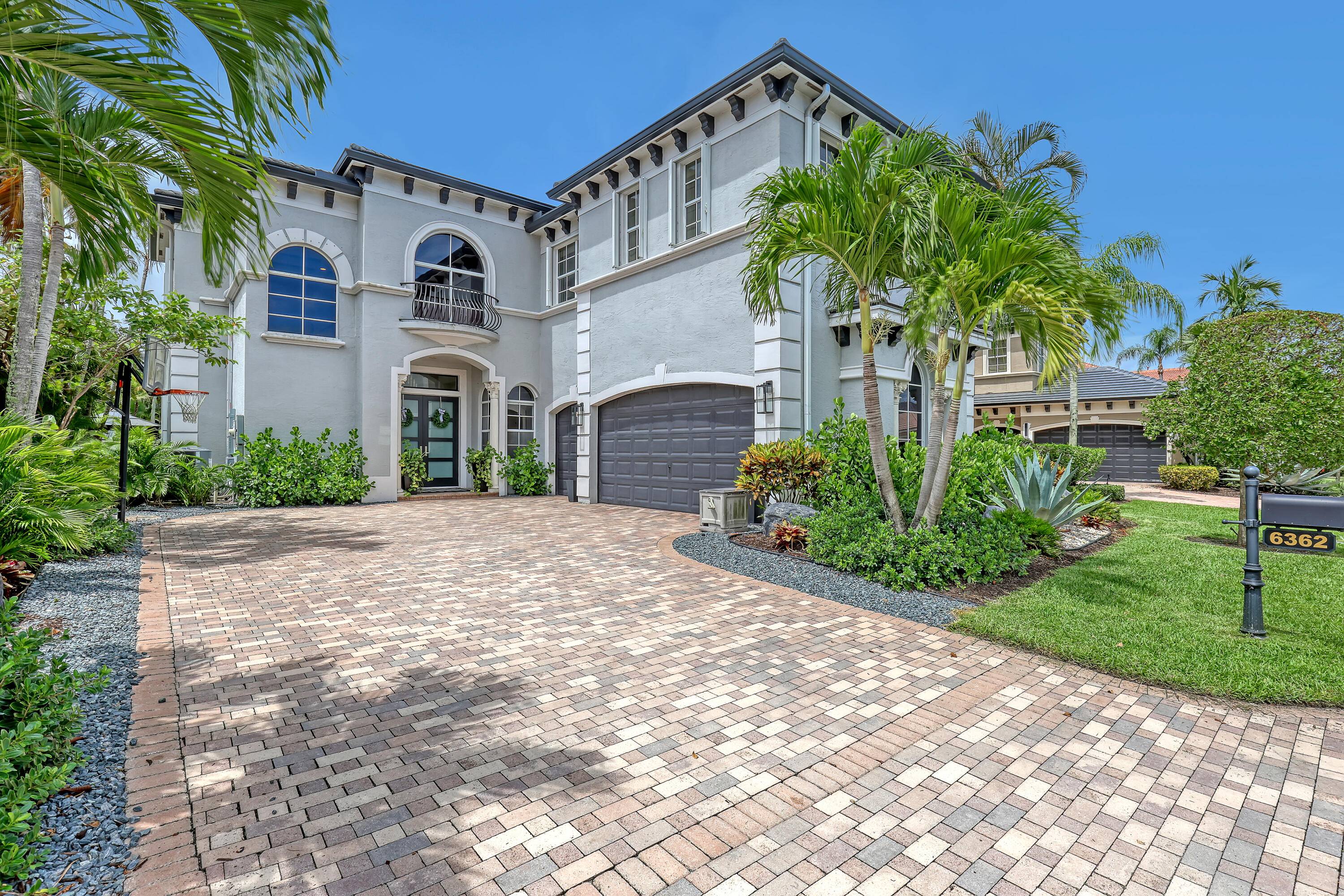 Welcome to this luxurious 5 bedroom, 4 bathroom two story home, ideally located on Millionaires Row in the prestigious Mizners Preserve community.