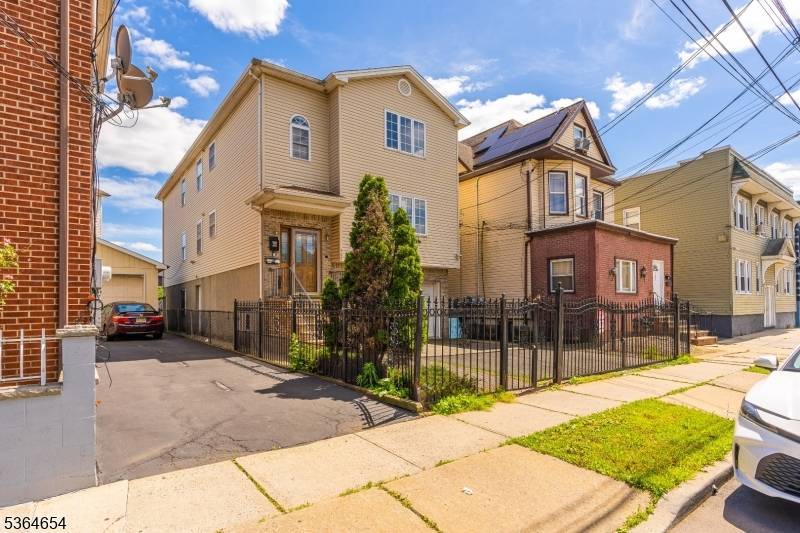 Impeccable two family home built in 2000 featuring central heat and air, beautiful hardwood floors throughout.