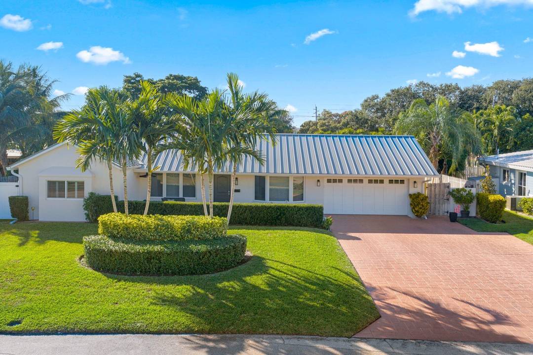 Beautifully updated 4 bedroom, 3 bathroom pool home with a triple split floor plan, and full two car garage with epoxy floors, located on a quiet street in Lighthouse short ...