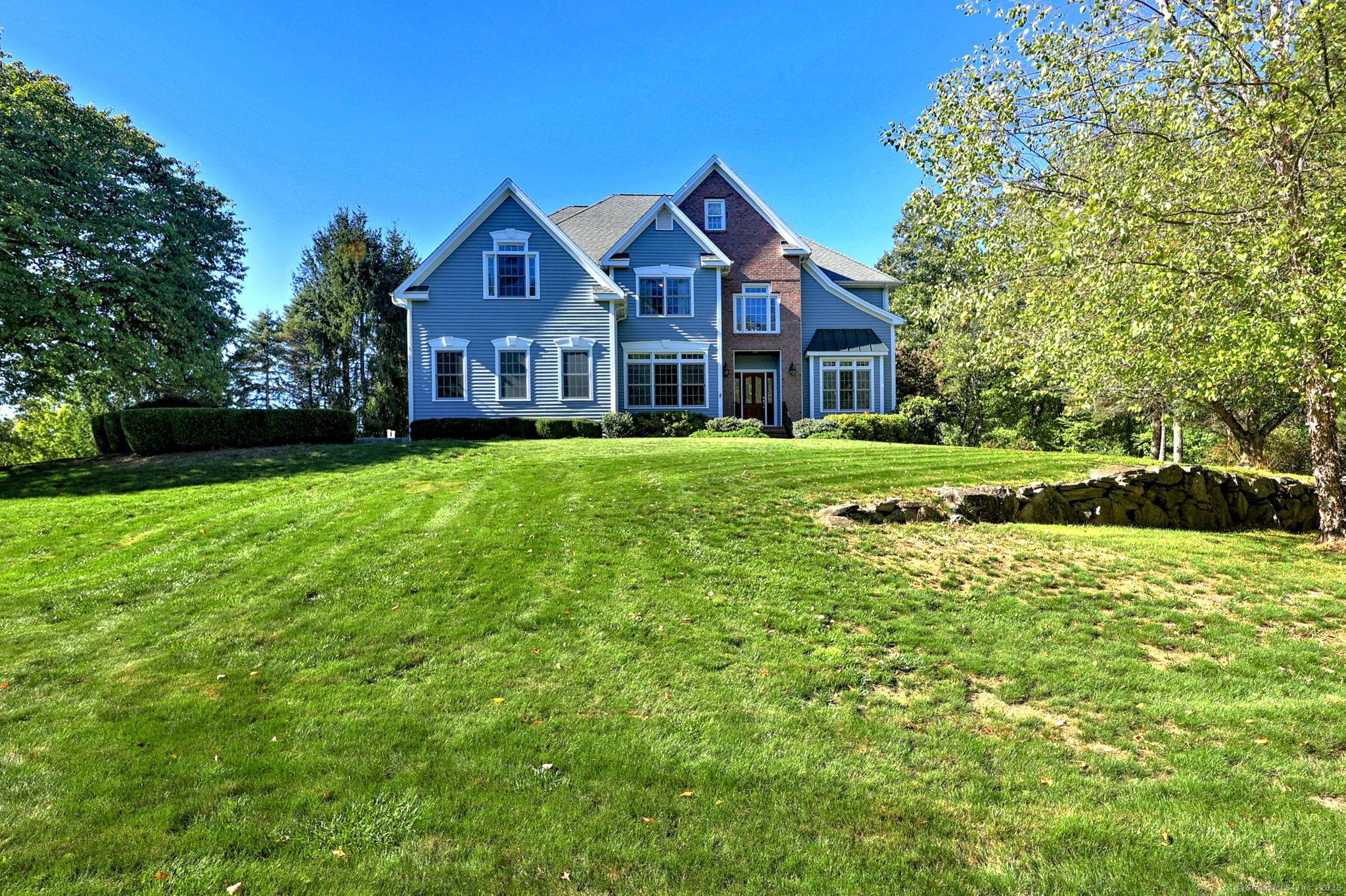 Step into timeless elegance in this impeccably maintained Colonial, gracely situated in Monroe's prestigious Hammertown Estates.