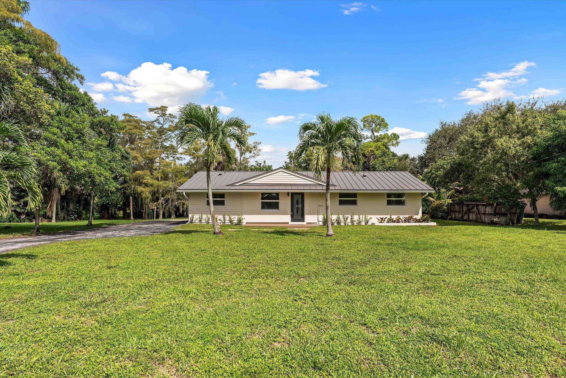 Discover this completely renovated 4 bedroom, 2 bath home on nearly an acre in the prestigious and highly sought after community of Square Lake.