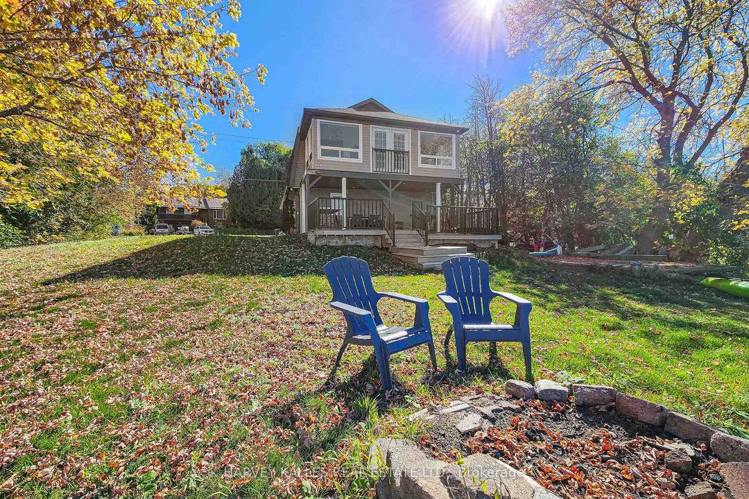 Picture lake view living on Lake Scugog at this fully renovated 4 seasons home with private shoreline and direct lake access !